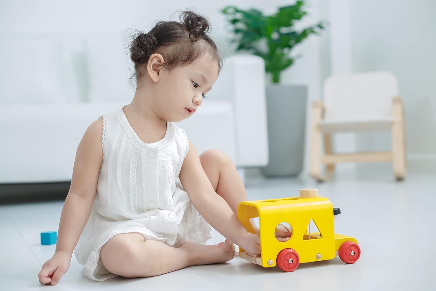 image:imagePlanToys Sorting Bus Pull Toy  Sustainably Made from Rubberwood Featuring OrganicPigment Coloring and WaterBased Dyes with 3 Colorful Shapes and PullAlong Bus