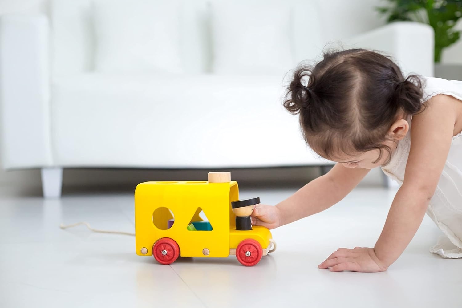 image:imagePlanToys Sorting Bus Pull Toy  Sustainably Made from Rubberwood Featuring OrganicPigment Coloring and WaterBased Dyes with 3 Colorful Shapes and PullAlong Bus